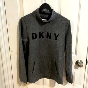 Lightly used dkny sweater with zipper feature